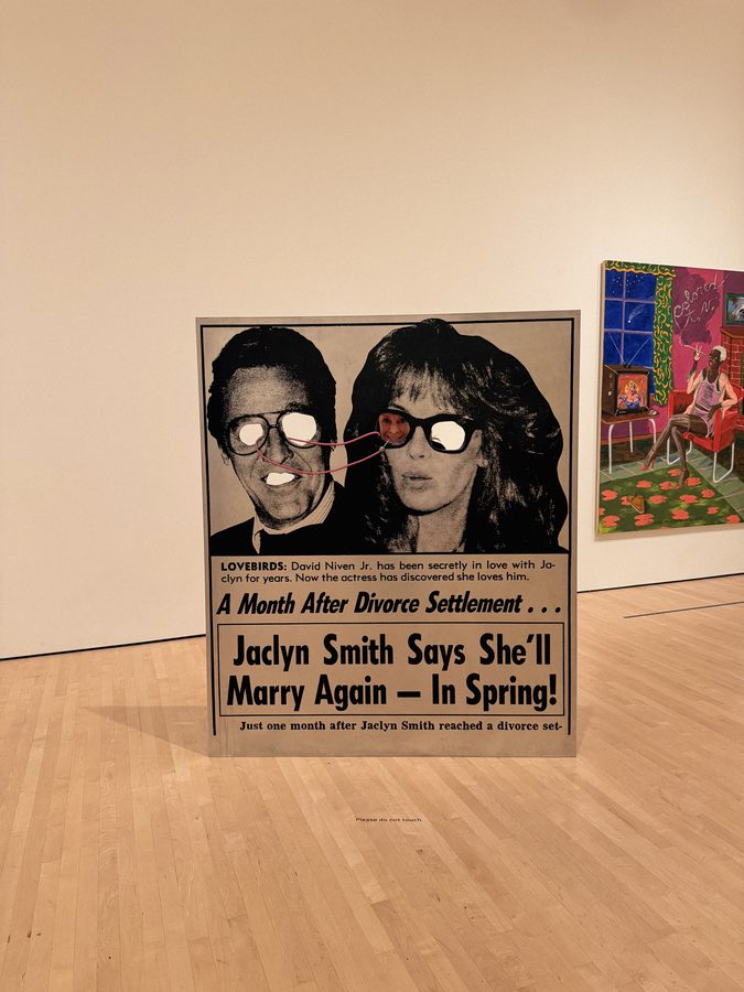 Tabloid cut-out artwork in a gallery